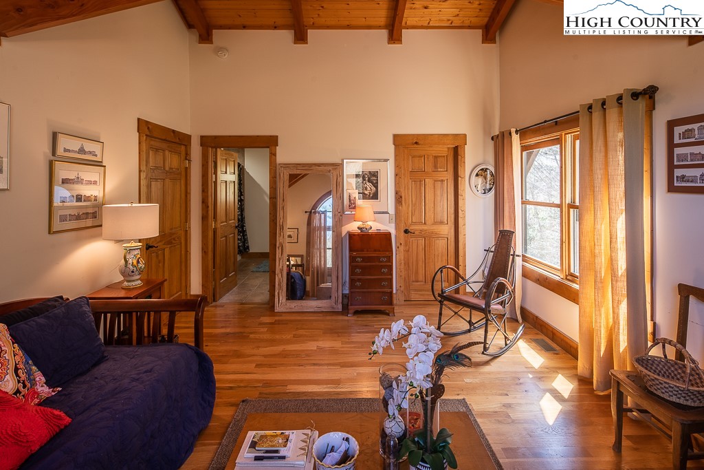 154 Lilac Lane Boone, NC 28607 - Photo 34 of 50 a living room with furniture a rug and a flat screen tv