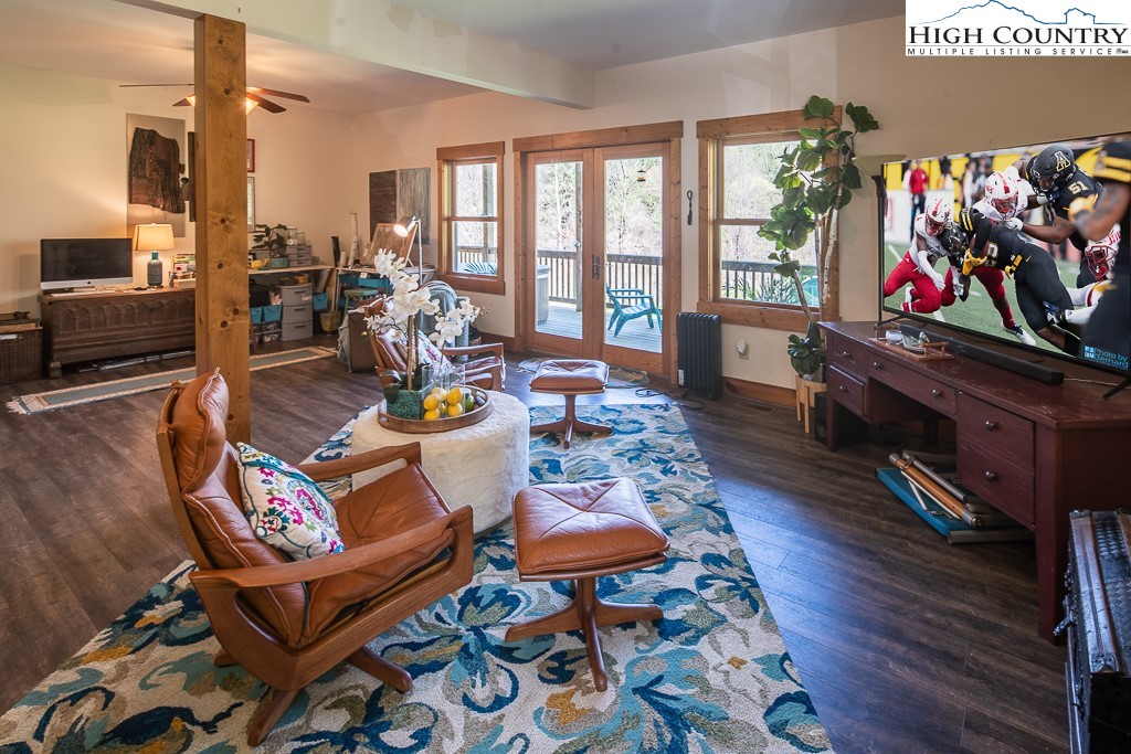 154 Lilac Lane Boone, NC 28607 - Photo 38 of 50 a living room filled with furniture hardwood floor and a floor to ceiling window