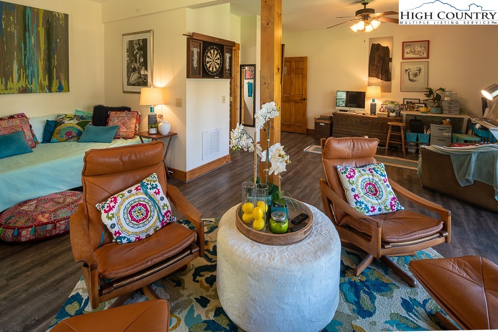 154 Lilac Lane Boone, NC 28607 - Photo 39 of 50 a living room with furniture and a dining table with garden view