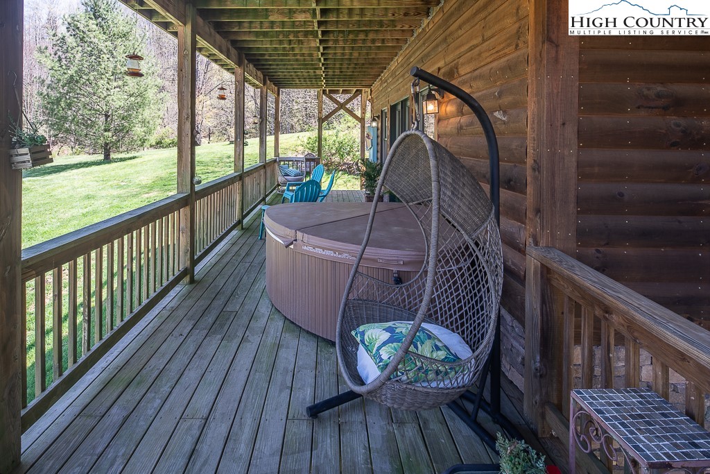 154 Lilac Lane Boone, NC 28607 - Photo 43 of 50 a view of balcony with wooden floor and outdoor seating
