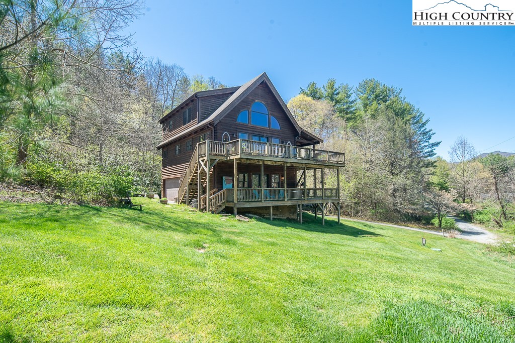 154 Lilac Lane Boone, NC 28607 - Photo 45 of 50 a view of a house with a big yard and large trees