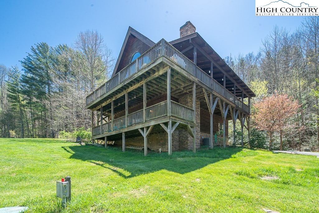 154 Lilac Lane Boone, NC 28607 - Photo 47 of 50 a view of a house with backyard and trees