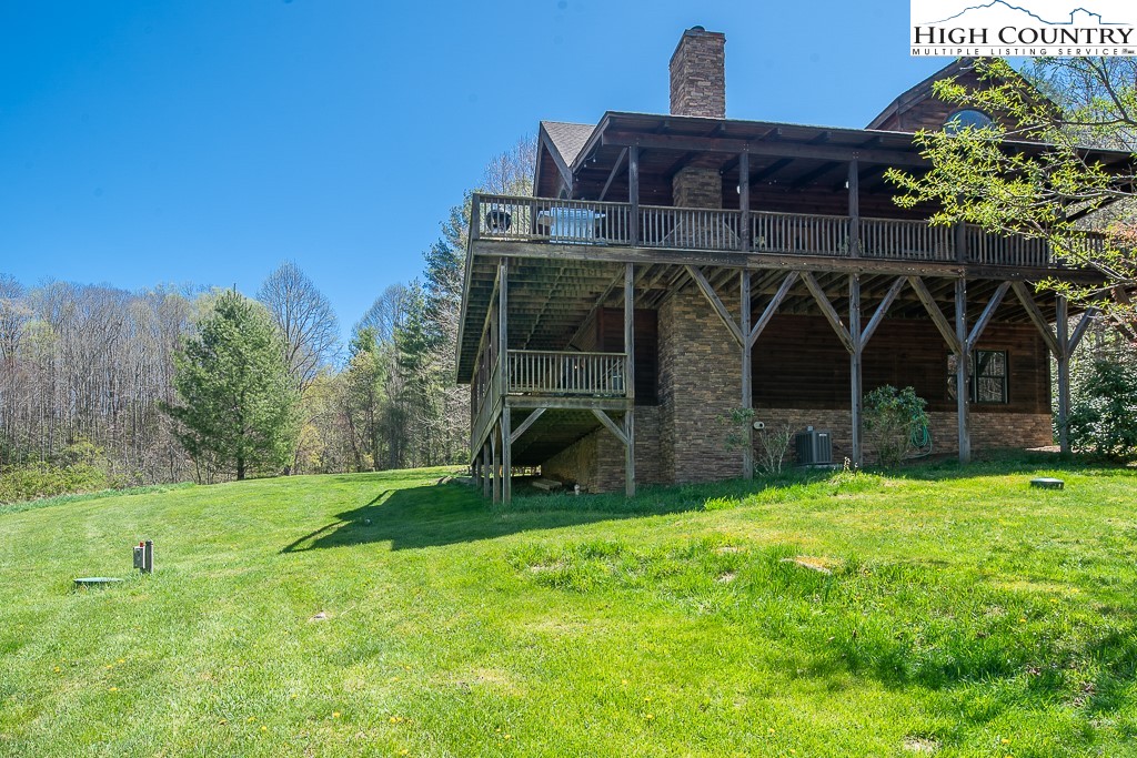 154 Lilac Lane Boone, NC 28607 - Photo 48 of 50 a view of a chair and table in the garden