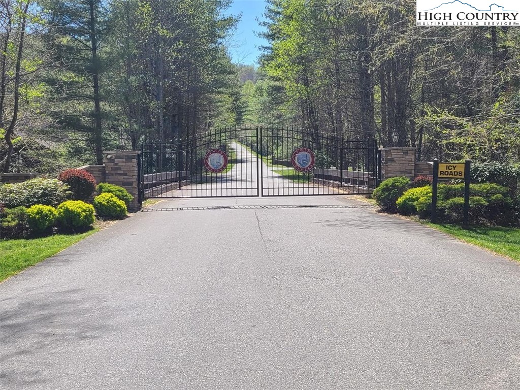 154 Lilac Lane Boone, NC 28607 - Photo 50 of 50 a view of a garden with a bench