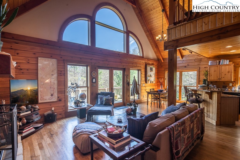 154 Lilac Lane Boone, NC 28607 - Photo 10 of 50 a living room with furniture and a flat screen tv