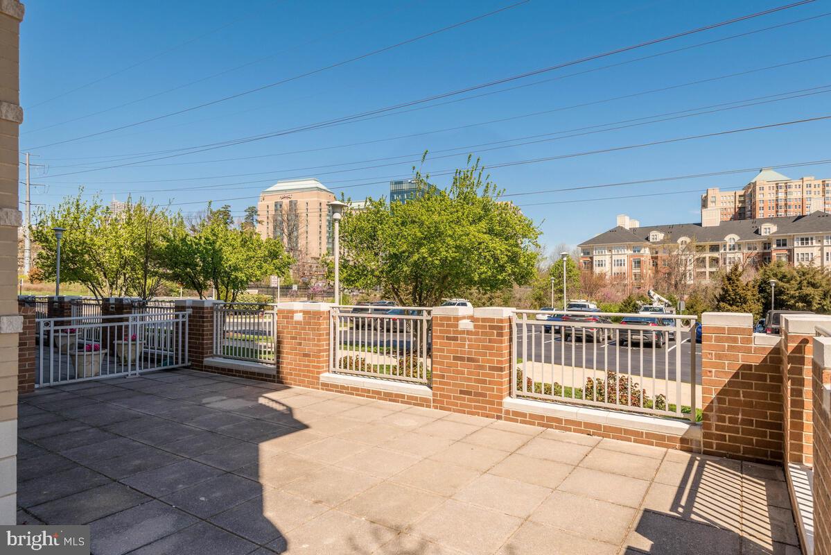 11800 Sunset Hills Road, Unit 514 Reston, VA 20190 - Photo 9 of 57 a view of a chairs and table in the patio