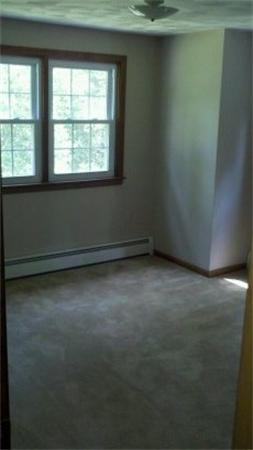 18 Randall Road Rochester, MA 02770 - Photo 9 of 17 an empty room with a window