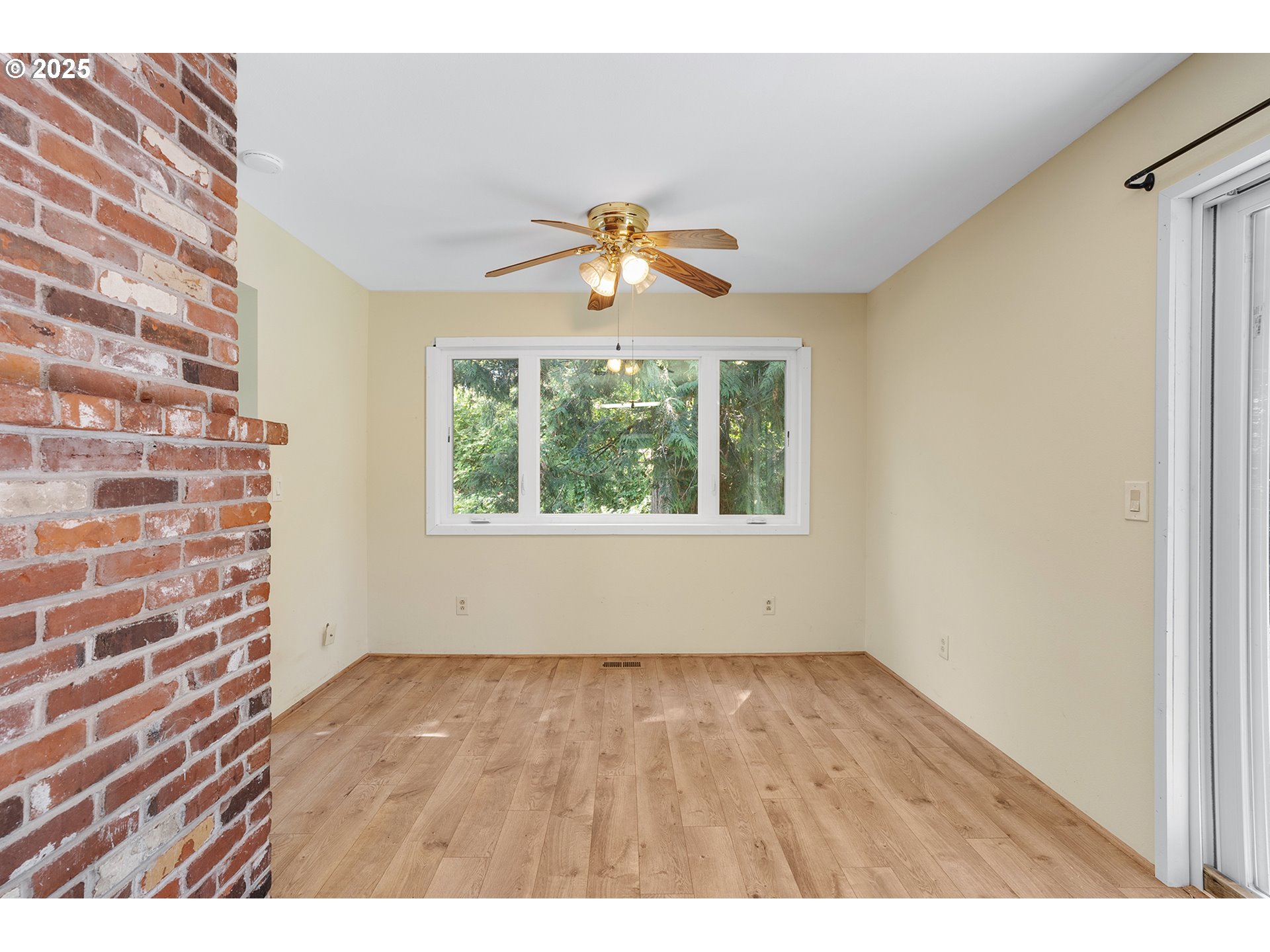 701 Northeast Evans Road Corbett, OR 97019 - Photo 13 of 48 a view of an empty room with window and wooden floor