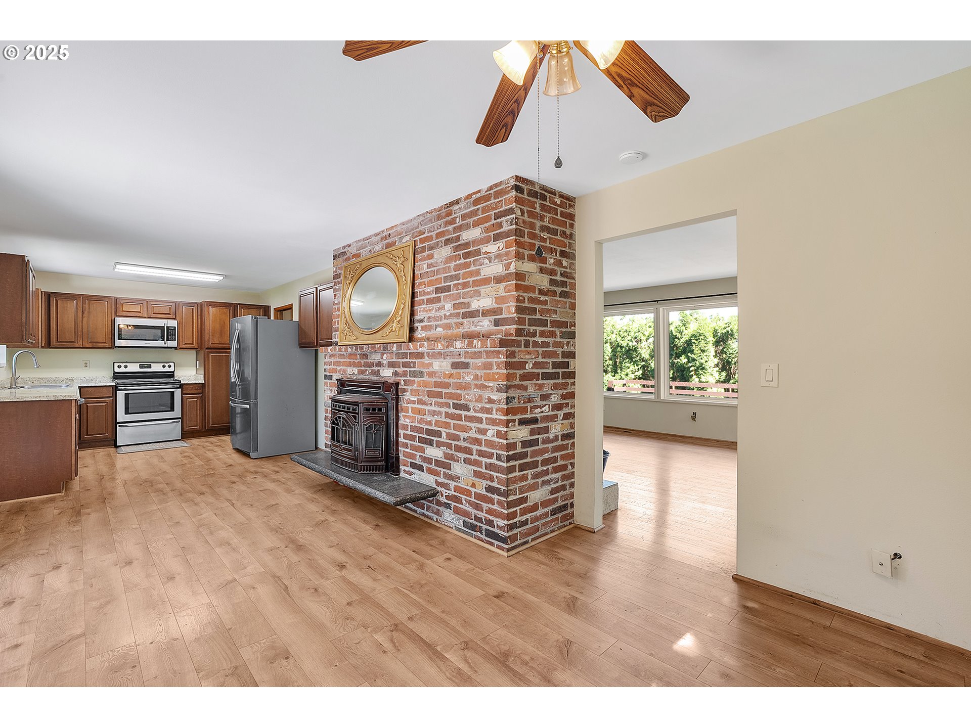 701 Northeast Evans Road Corbett, OR 97019 - Photo 15 of 48 a view of kitchen with furniture and a fireplace