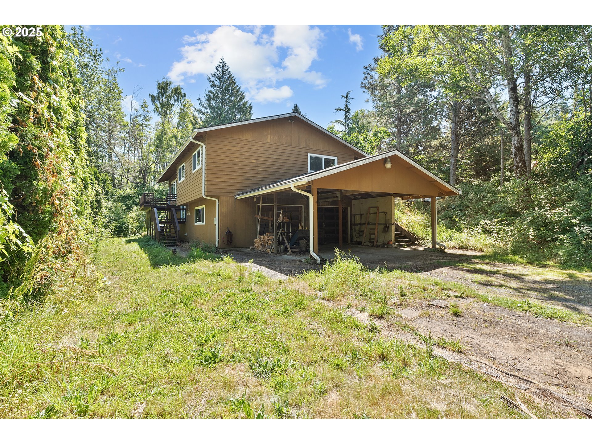 701 Northeast Evans Road Corbett, OR 97019 - Photo 2 of 48 a house with green field in front of it