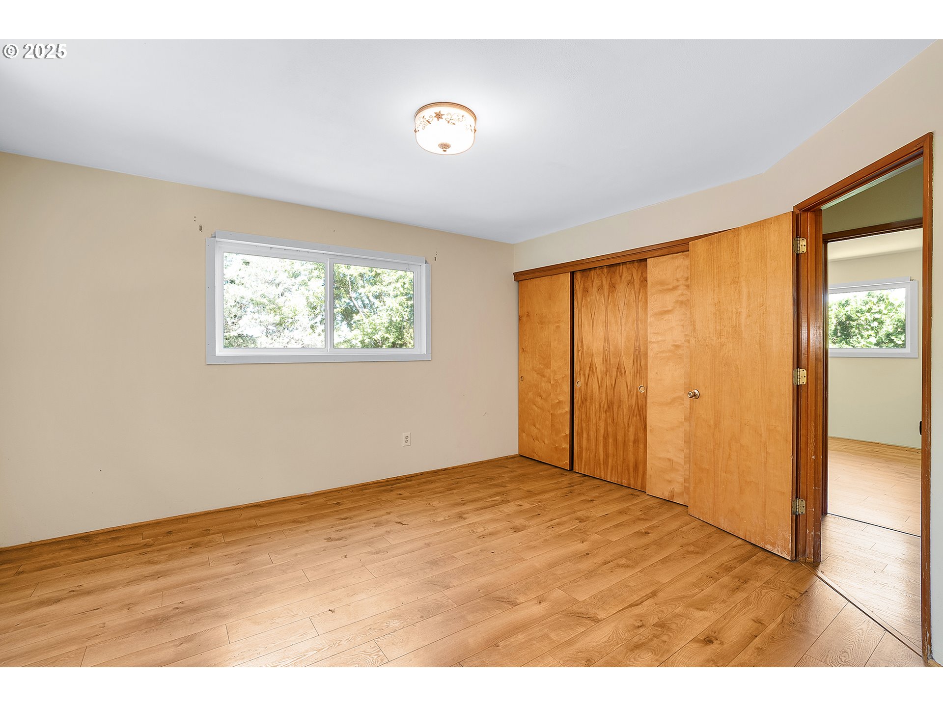 701 Northeast Evans Road Corbett, OR 97019 - Photo 23 of 48 a view of an empty room with wooden floor and a window