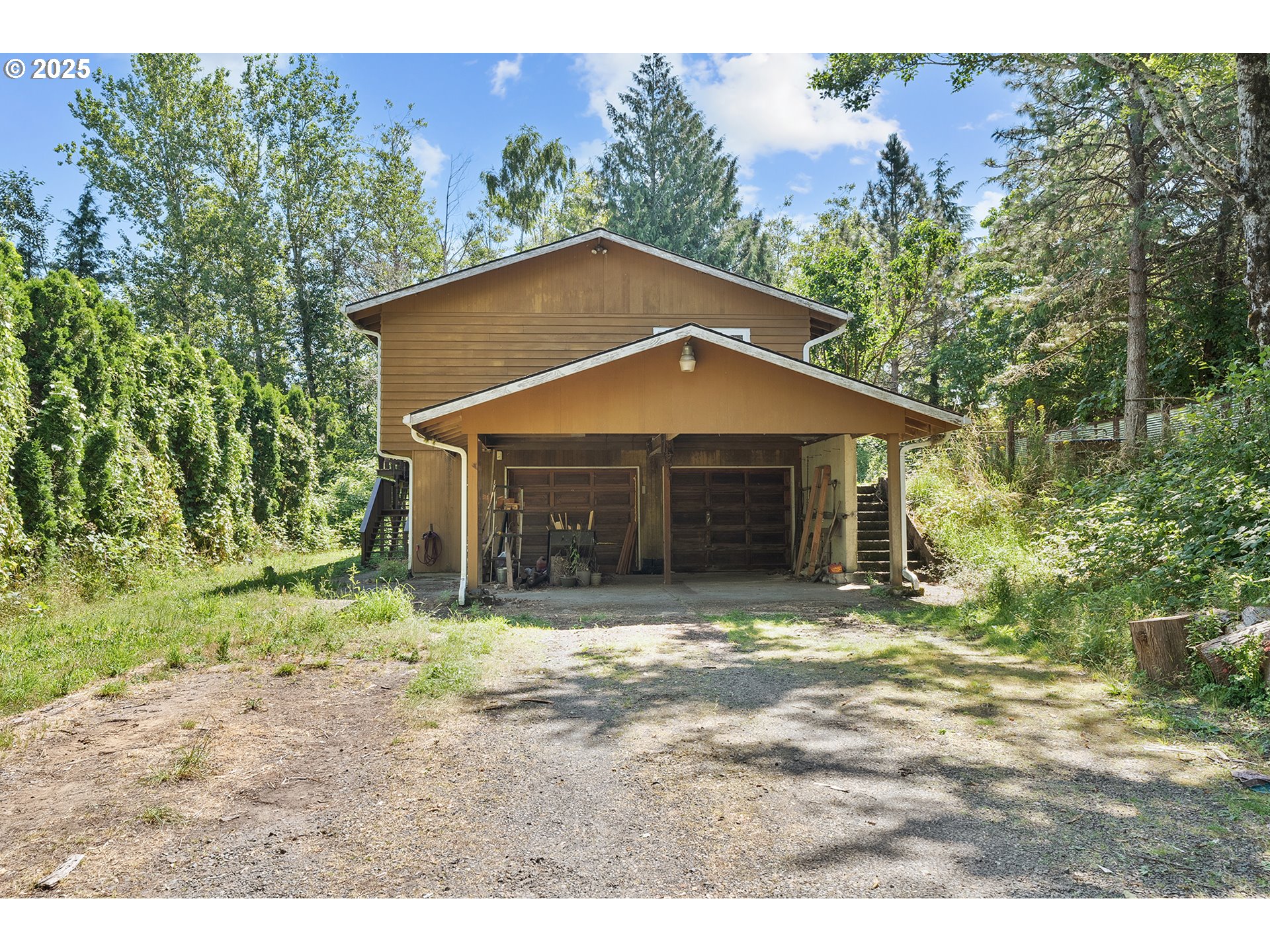 701 Northeast Evans Road Corbett, OR 97019 - Photo 4 of 48 a front view of a house with a yard