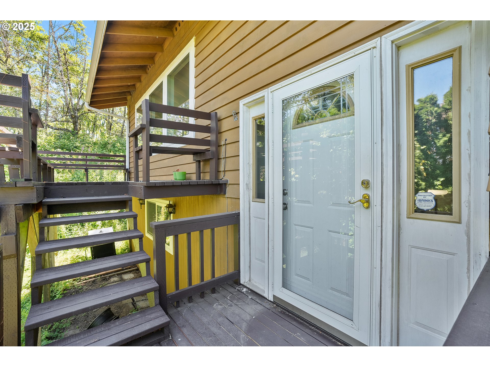 701 Northeast Evans Road Corbett, OR 97019 - Photo 5 of 48 a view of a front door and deck
