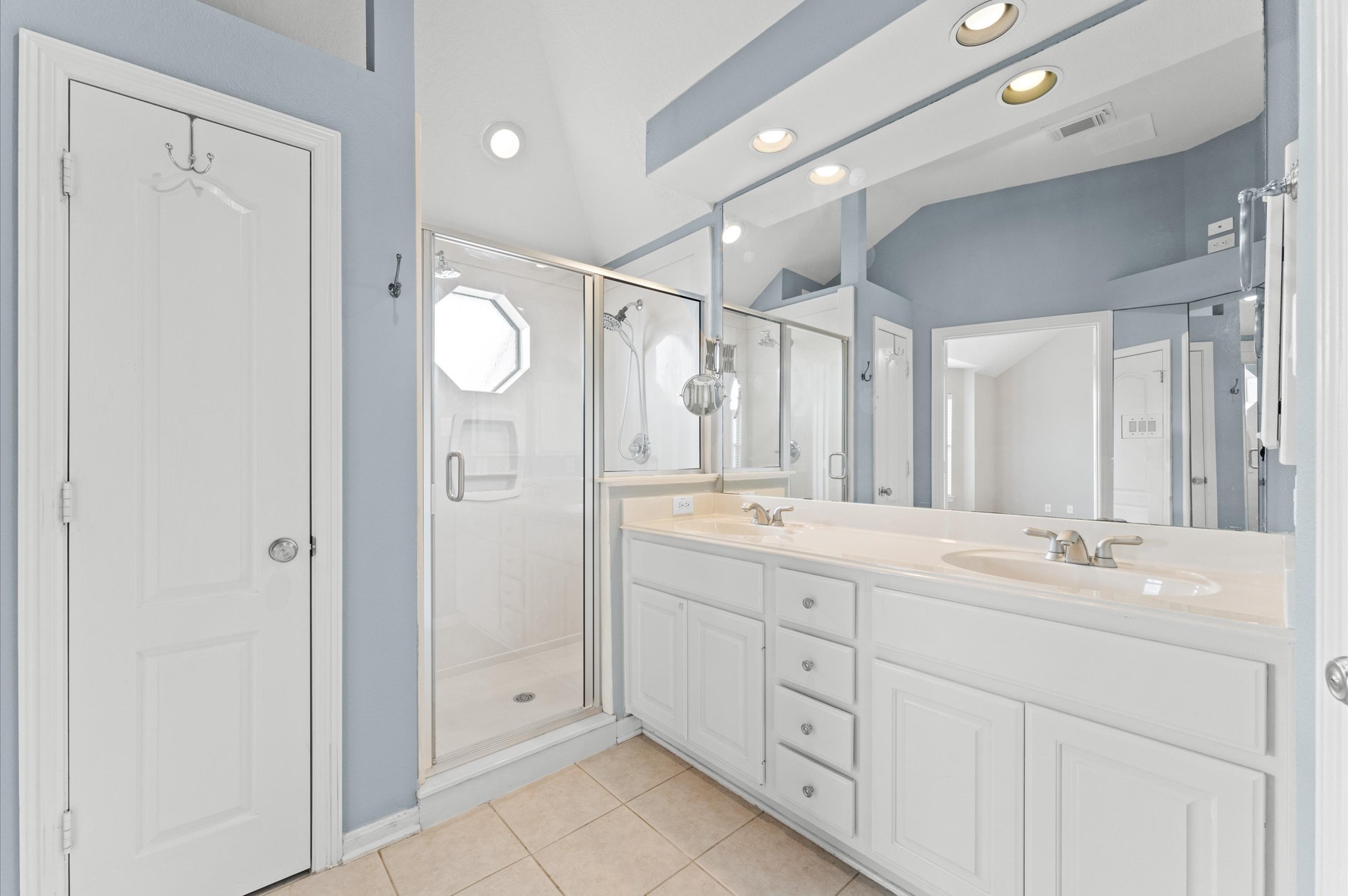 2411 Clippers Square Houston, TX 77058 - Photo 22 of 25 a spacious bathroom with a double vanity sink mirror and shower