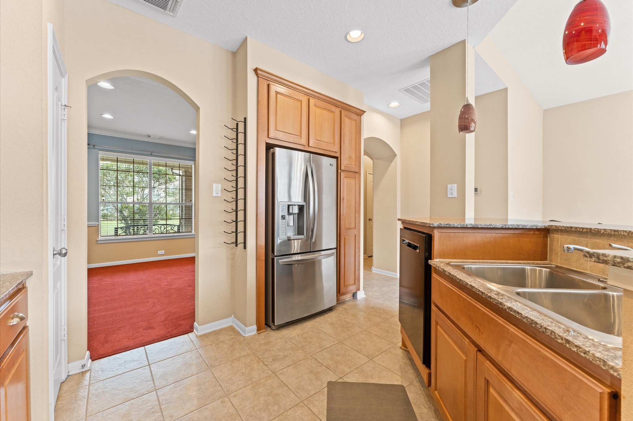 2411 Clippers Square Houston, TX 77058 - Photo 7 of 25 a kitchen with a refrigerator sink and cabinets