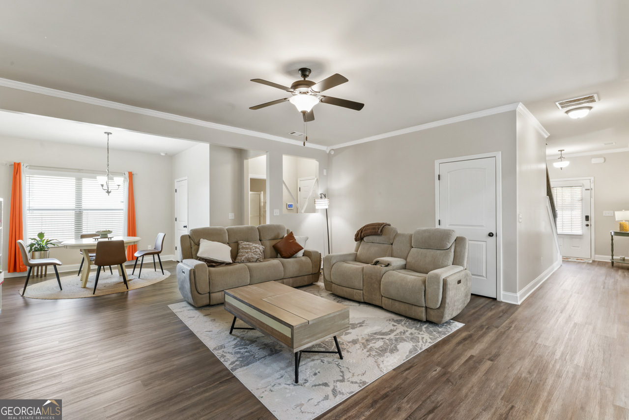 643 Patillo Road Stockbridge, GA 30281 - Photo 14 of 30 a living room with furniture and a wooden floor