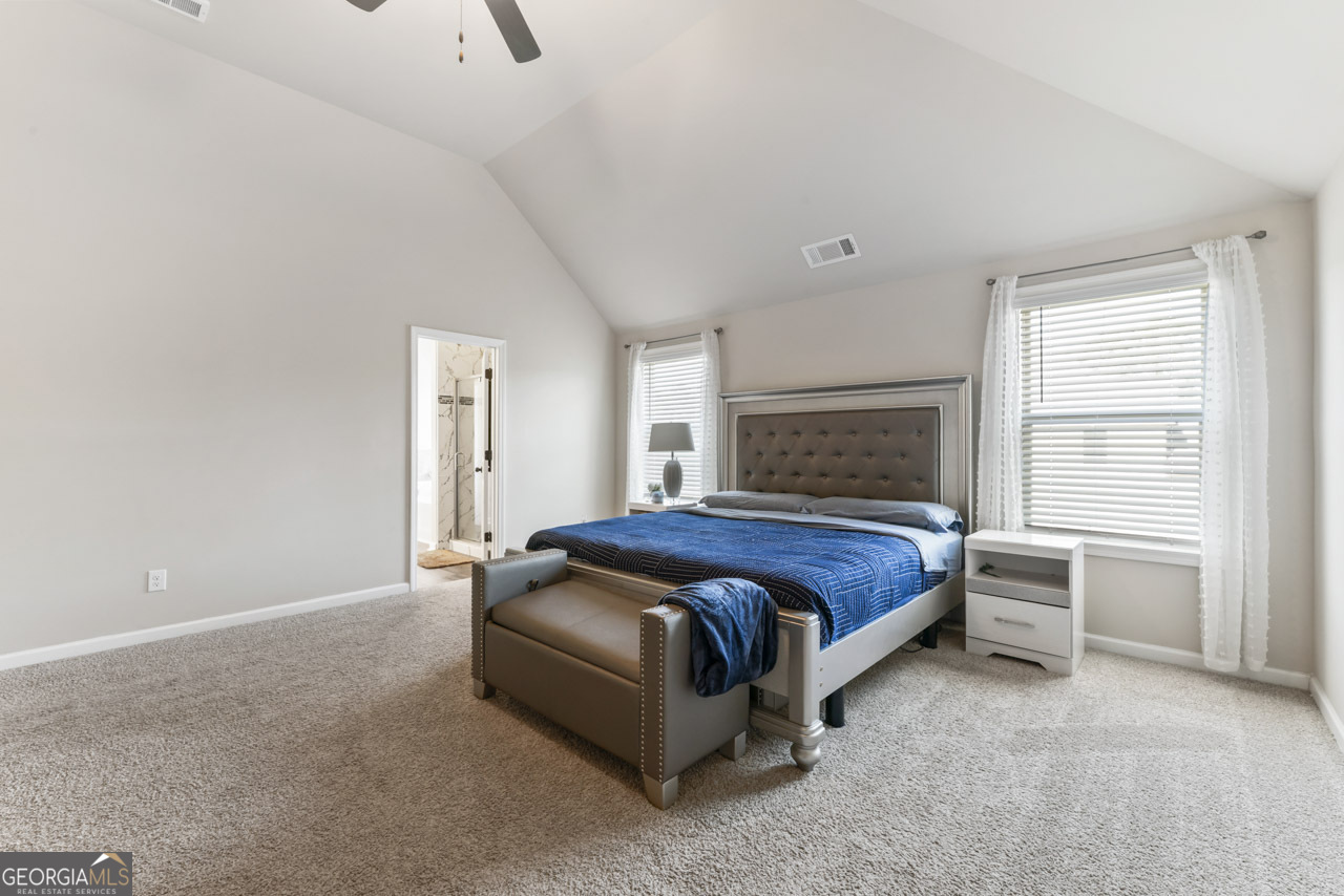 643 Patillo Road Stockbridge, GA 30281 - Photo 18 of 30 a bedroom with a bed and a window