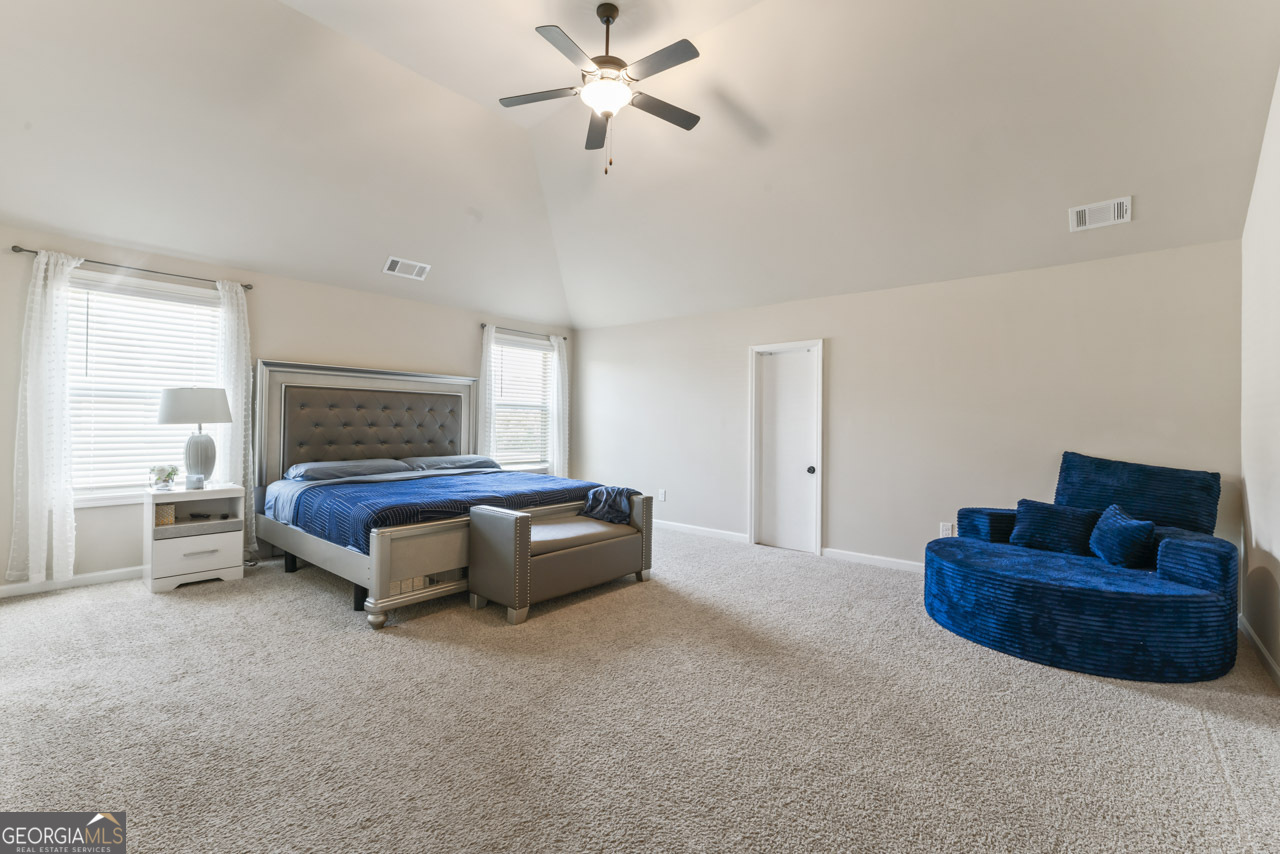 643 Patillo Road Stockbridge, GA 30281 - Photo 19 of 30 a bedroom with furniture and a couch