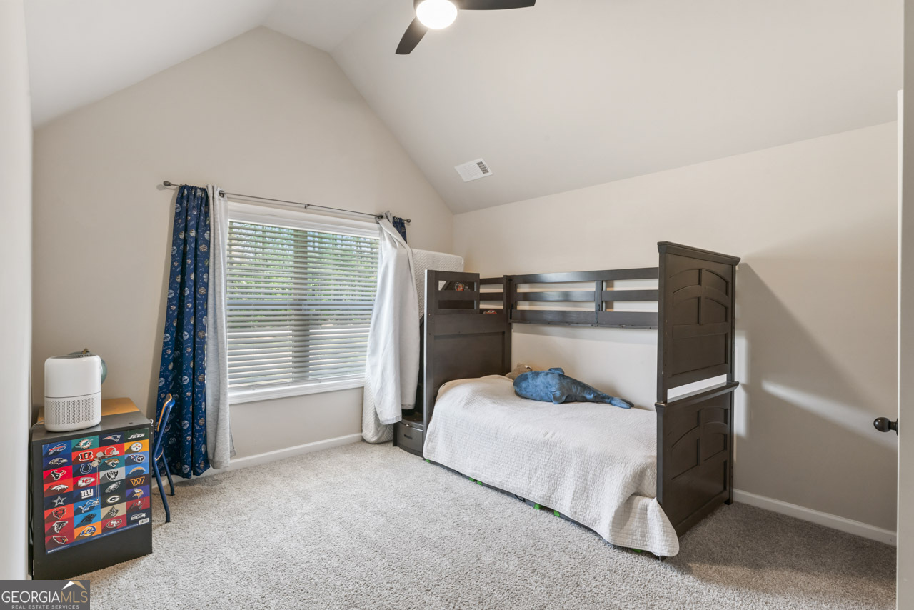 643 Patillo Road Stockbridge, GA 30281 - Photo 24 of 30 a bedroom with a bed furniture and a window