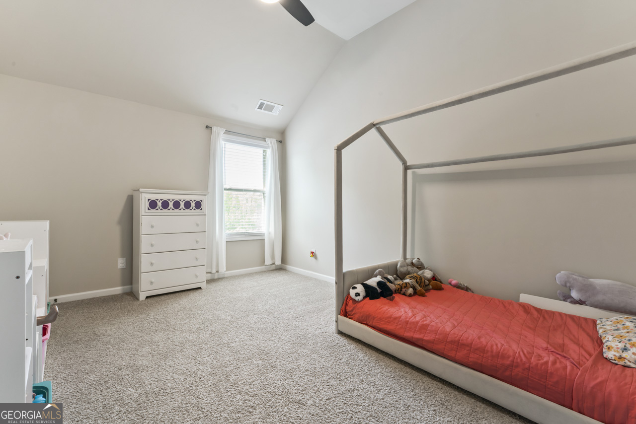 643 Patillo Road Stockbridge, GA 30281 - Photo 25 of 30 a bedroom with a bed and a cabinets