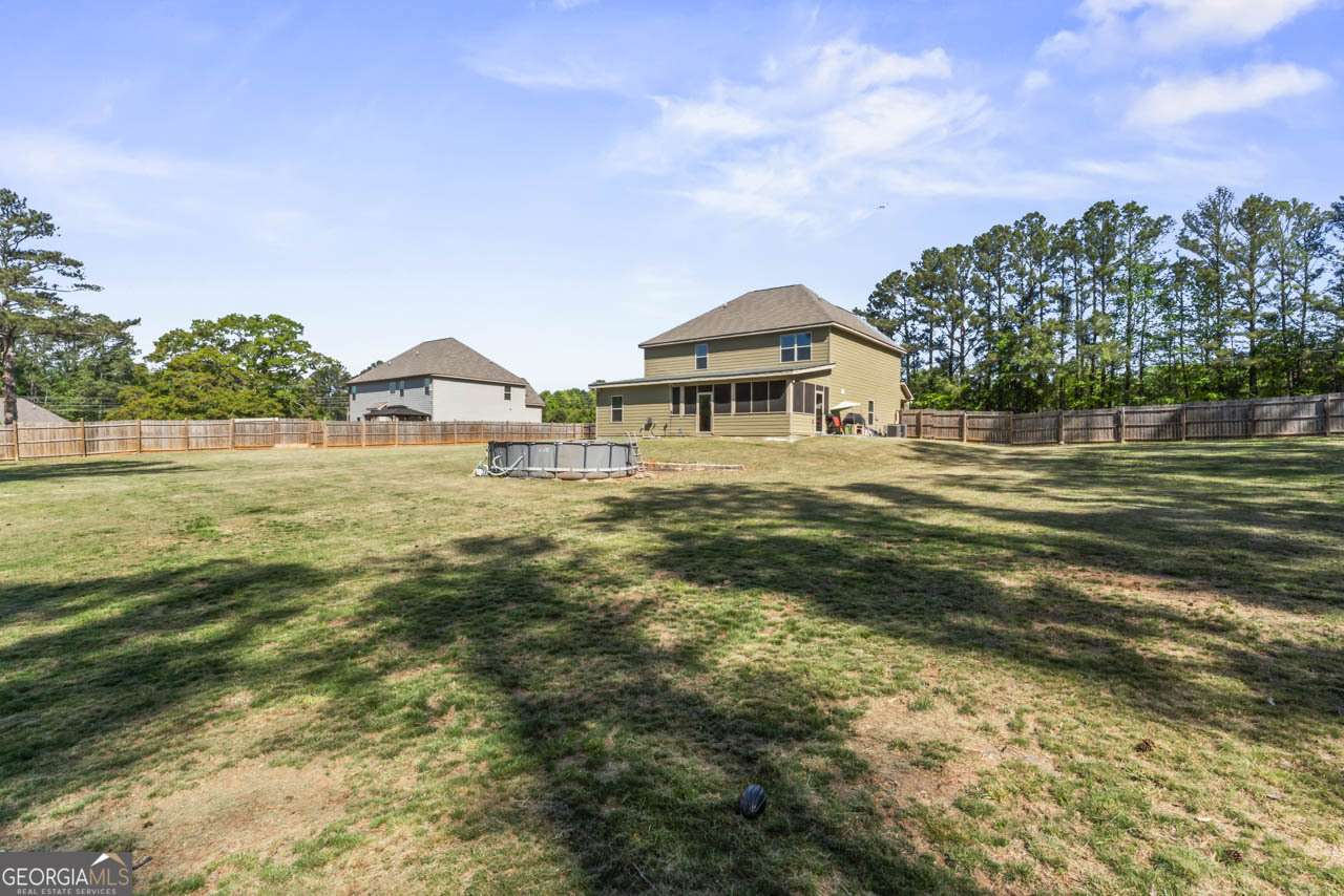 643 Patillo Road Stockbridge, GA 30281 - Photo 30 of 30 a view of a swimming pool and a yard