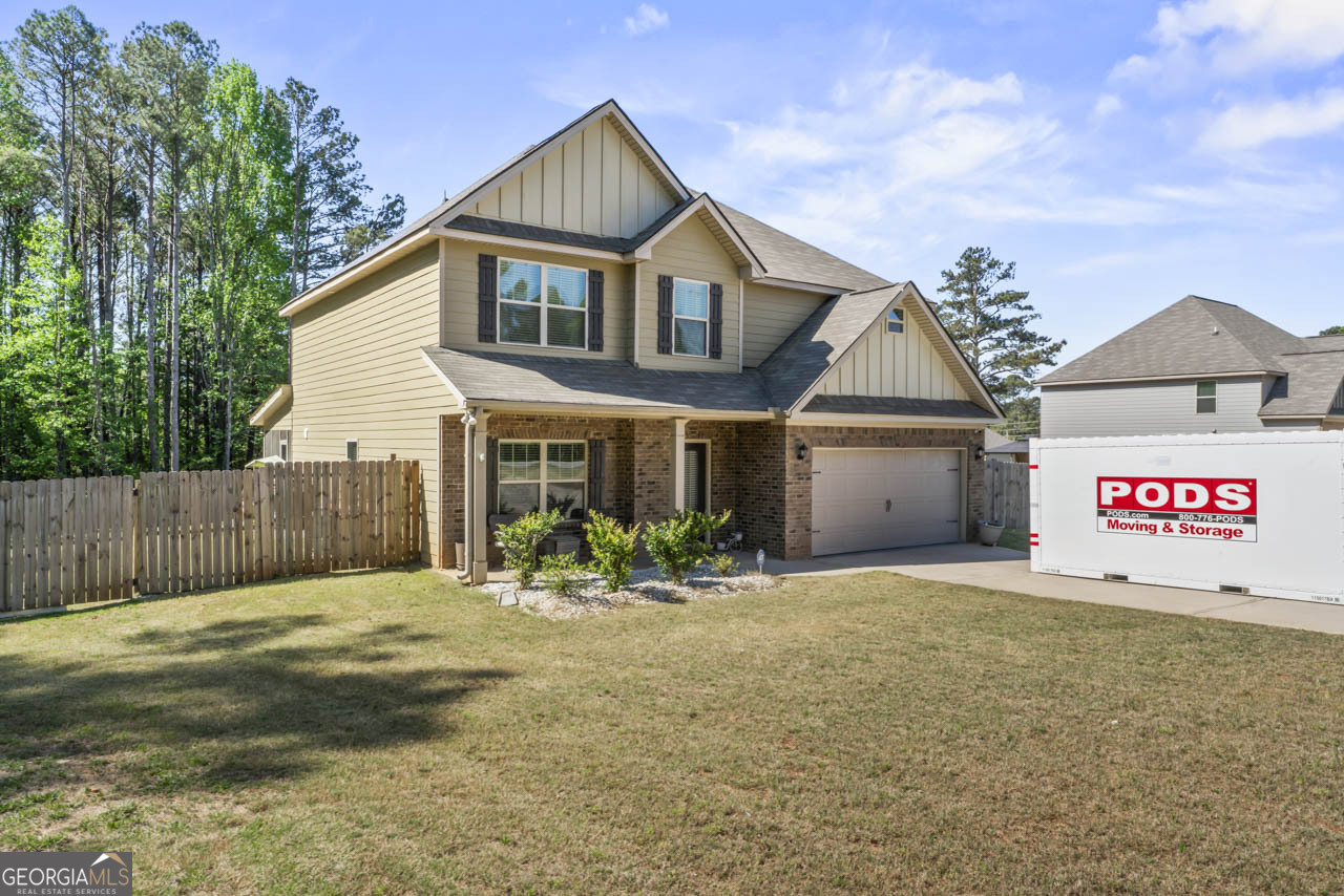 643 Patillo Road Stockbridge, GA 30281 - Photo 3 of 30 a front view of a house with a yard and garage