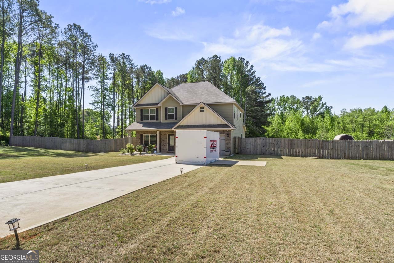 643 Patillo Road Stockbridge, GA 30281 - Photo 5 of 30 a view of a house with a yard and large trees