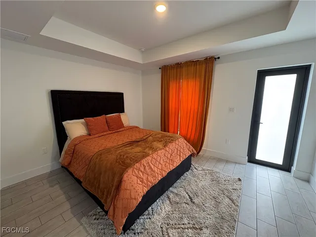 a kitchen with a sink cabinets and a window