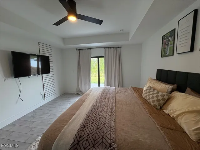 a bedroom with a bed and a chair