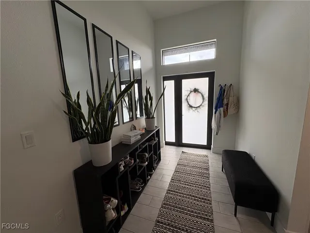 a large kitchen with kitchen island granite countertop a large counter top stainless steel appliances and cabinets