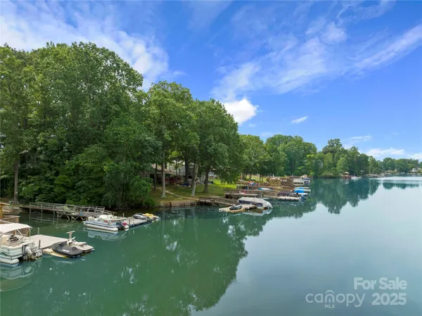a view of lake with green space