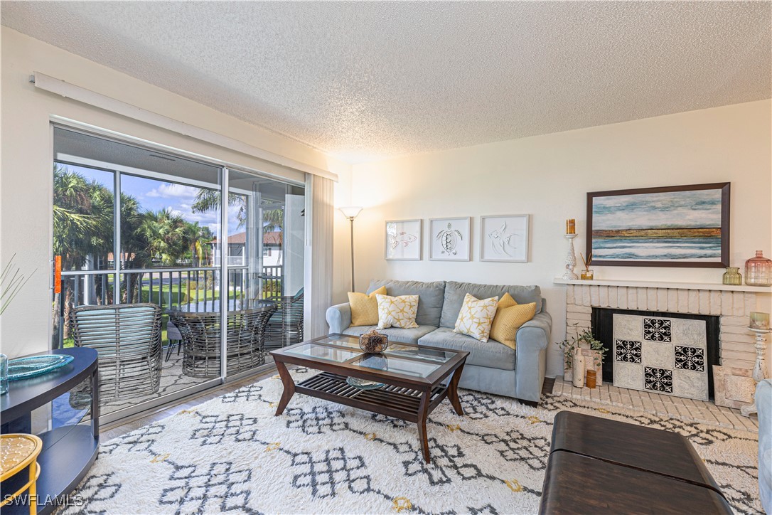 7043 New Post Road, Unit 7 North Fort Myers, FL 33917 - Photo 12 of 26 a living room with furniture lamp and rug