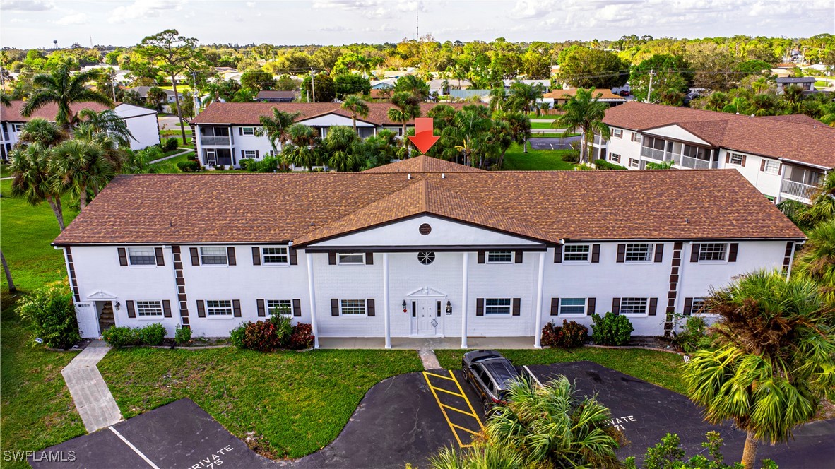 7043 New Post Road, Unit 7 North Fort Myers, FL 33917 - Photo 2 of 26 an aerial view of a house with garden