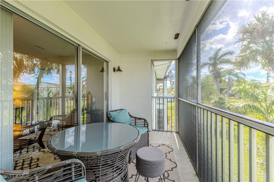 7043 New Post Road, Unit 7 North Fort Myers, FL 33917 - Photo 24 of 26 a living room with furniture and a window