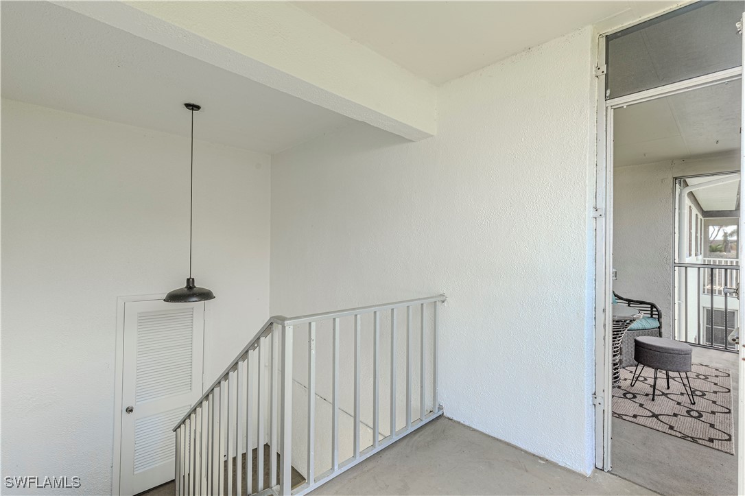 7043 New Post Road, Unit 7 North Fort Myers, FL 33917 - Photo 25 of 26 a view of a hallway with windows