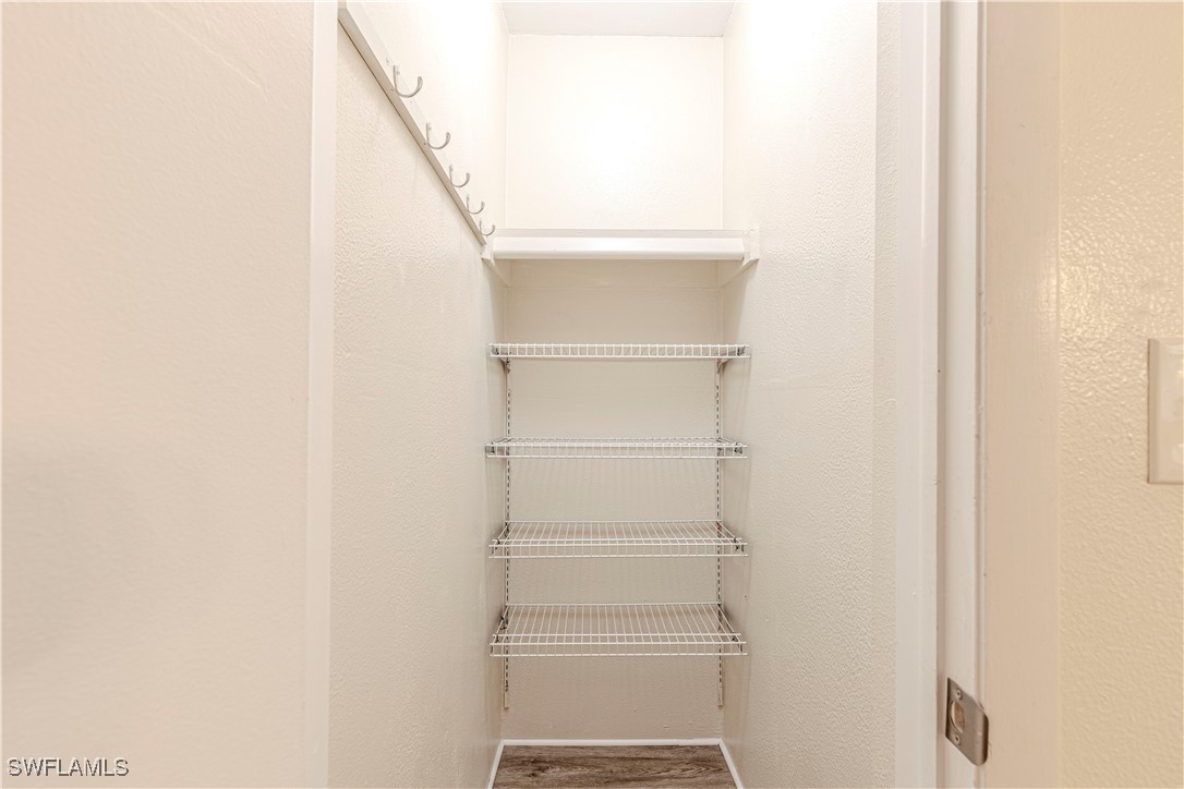 7043 New Post Road, Unit 7 North Fort Myers, FL 33917 - Photo 26 of 26 a view of walk in closet with empty racks