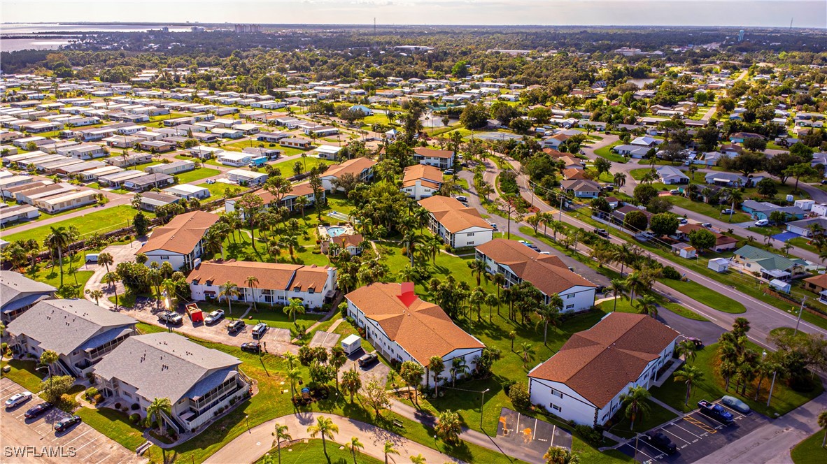 7043 New Post Road, Unit 7 North Fort Myers, FL 33917 - Photo 3 of 26 an aerial view of residential houses with outdoor space