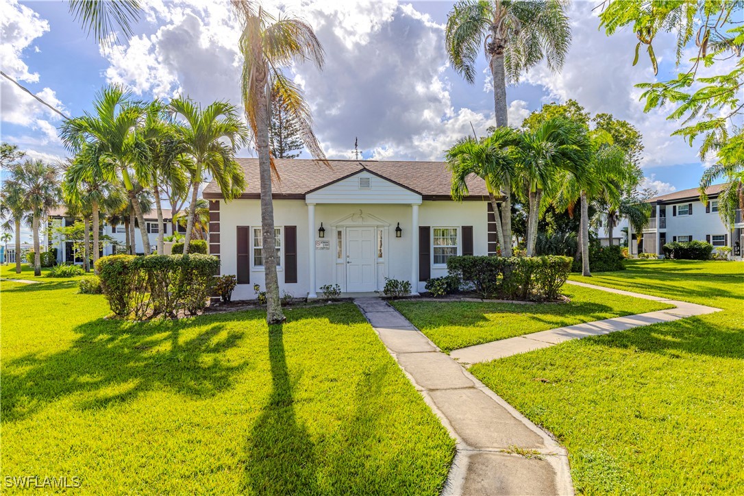 7043 New Post Road, Unit 7 North Fort Myers, FL 33917 - Photo 6 of 26 a view of swimming pool with outdoor seating and house in the background