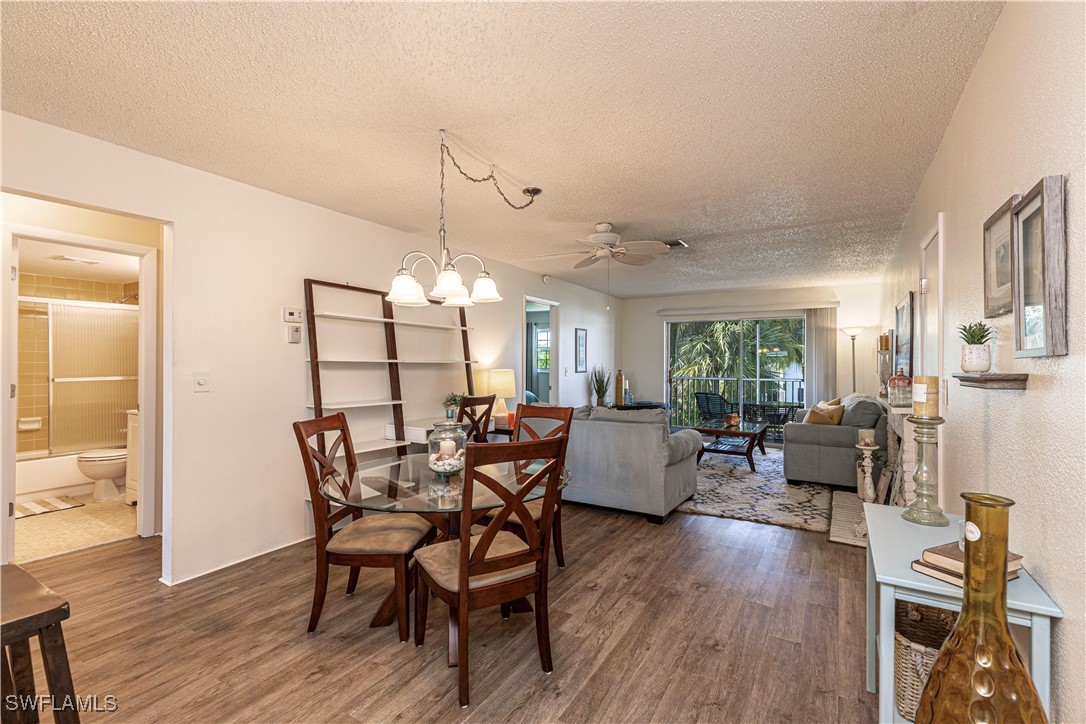 7043 New Post Road, Unit 7 North Fort Myers, FL 33917 - Photo 7 of 26 a view of a dining room with furniture window and wooden floor