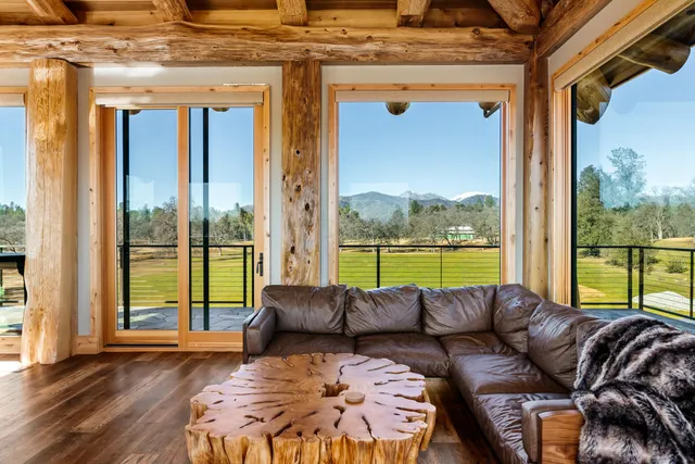 a view of a dining room with furniture and window