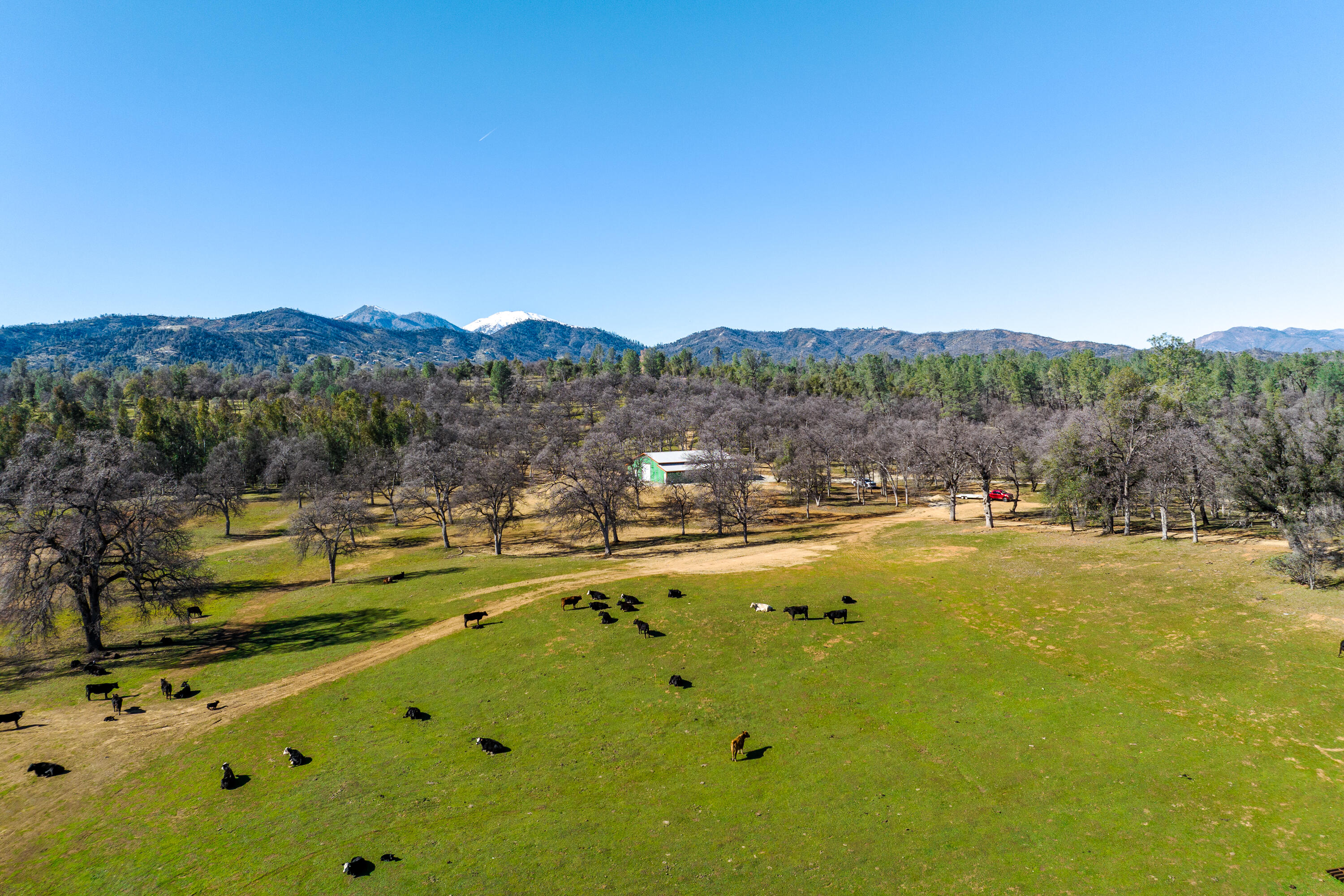 8499 Simmons Road Redding, CA 96001 - Photo 2 of 38 a view of a swimming pool with mountains in the background