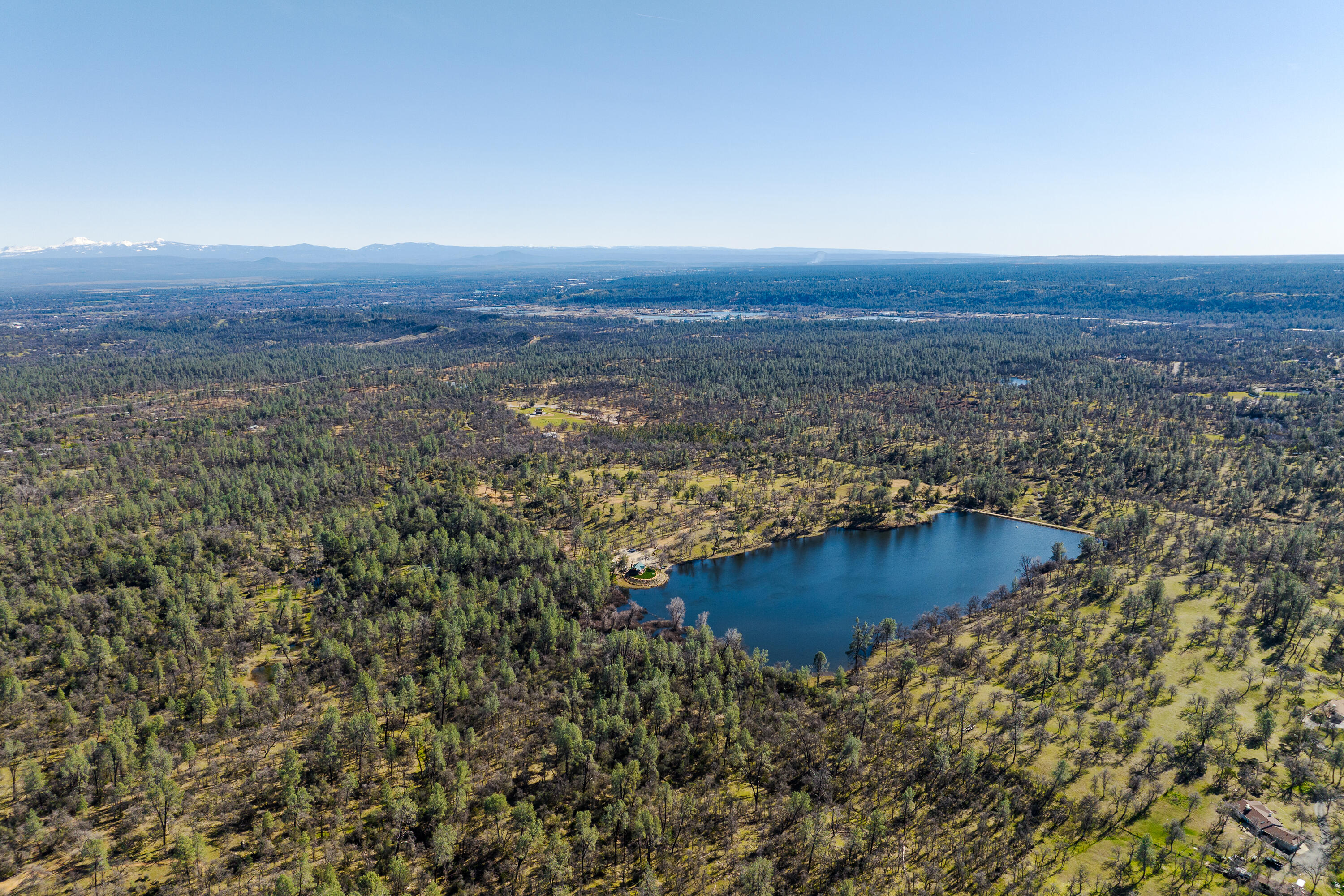 8499 Simmons Road Redding, CA 96001 - Photo 26 of 38 an aerial view of house with yard and mountain in the background