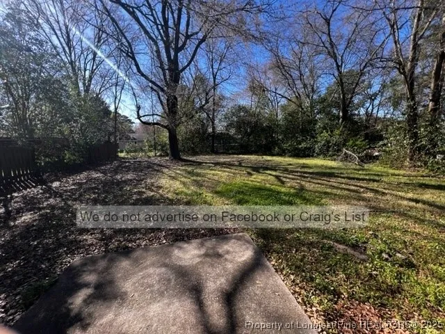 a view of a dirt road with a building