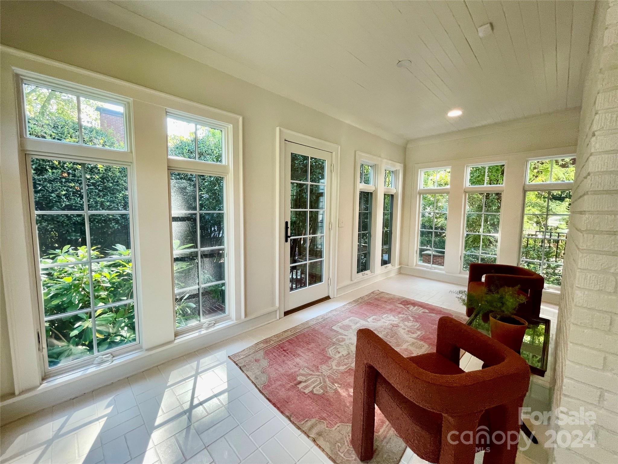 526 Lorimer Road Davidson, NC 28036 - Photo 11 of 41 a living room with furniture and large windows
