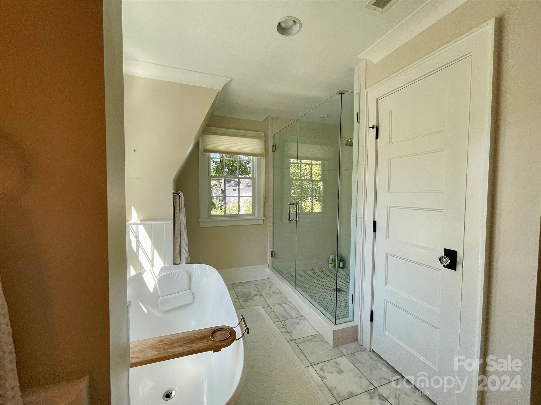 526 Lorimer Road Davidson, NC 28036 - Photo 22 of 41 a en suite bathroom with a shower