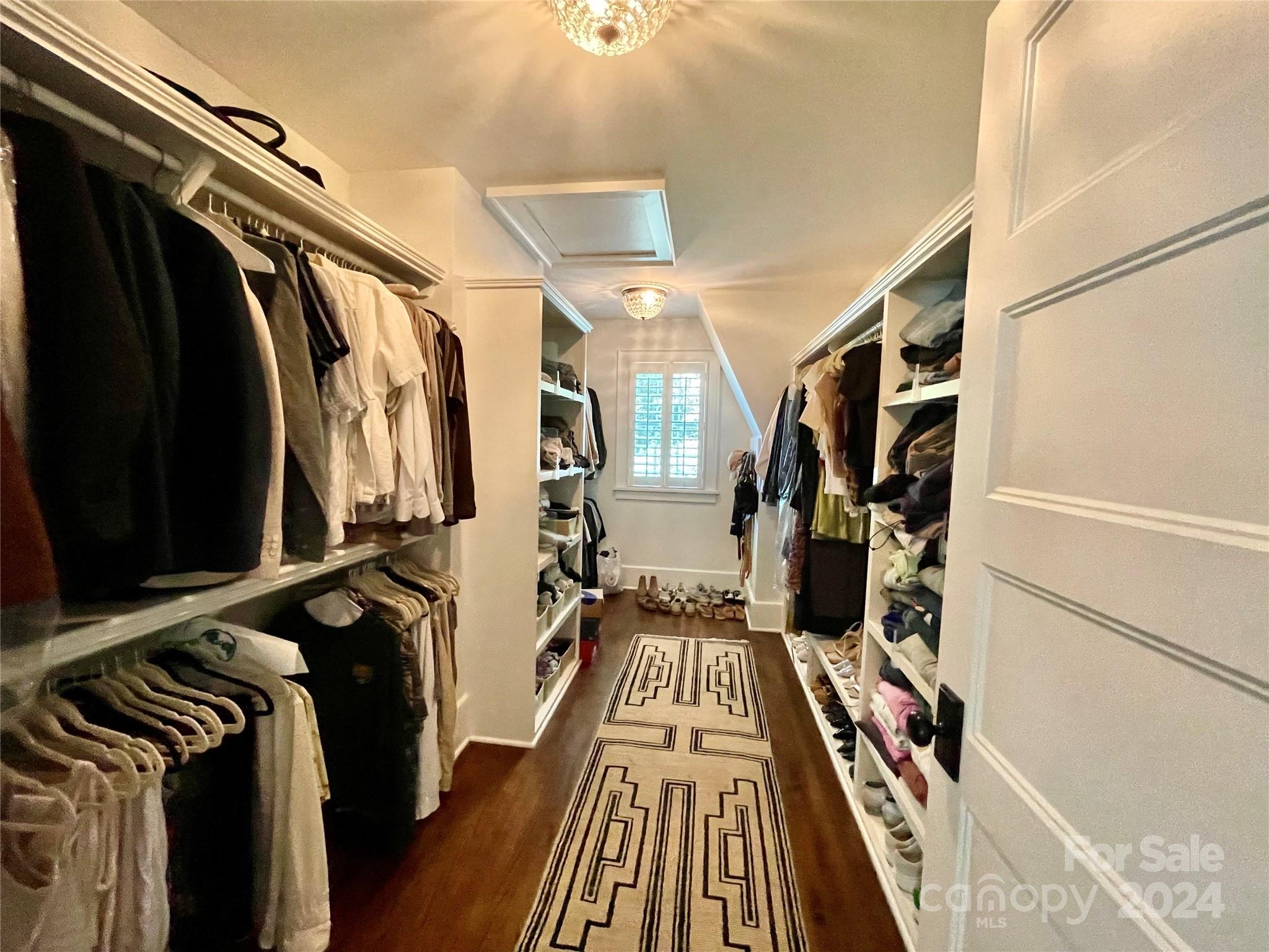 526 Lorimer Road Davidson, NC 28036 - Photo 27 of 41 a view of walk in closet with clothes and shoes