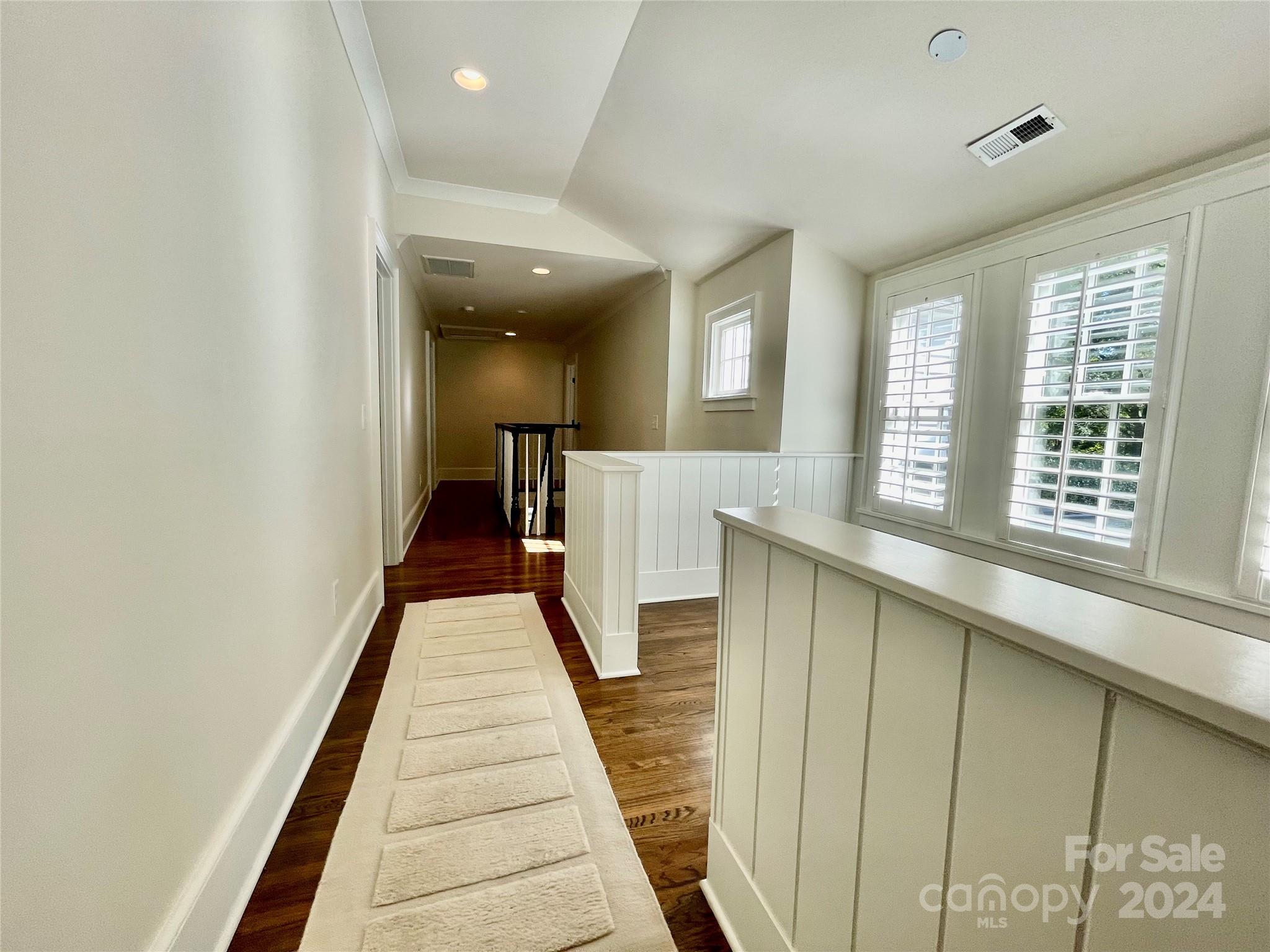 526 Lorimer Road Davidson, NC 28036 - Photo 29 of 41 a view of a hallway with wooden floor and staircase