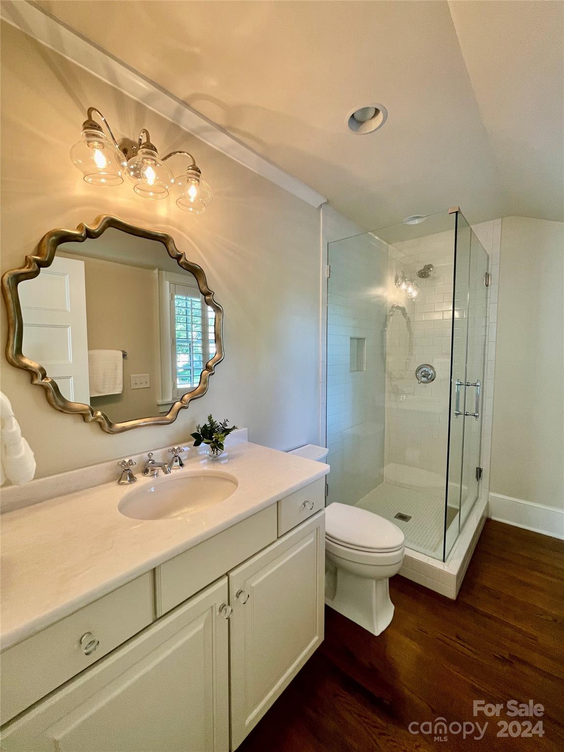 526 Lorimer Road Davidson, NC 28036 - Photo 31 of 41 a bathroom with a double vanity sink toilet and shower