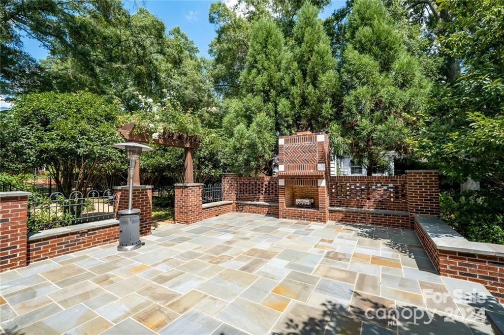 526 Lorimer Road Davidson, NC 28036 - Photo 36 of 41 a view of a chairs and bench in the patio