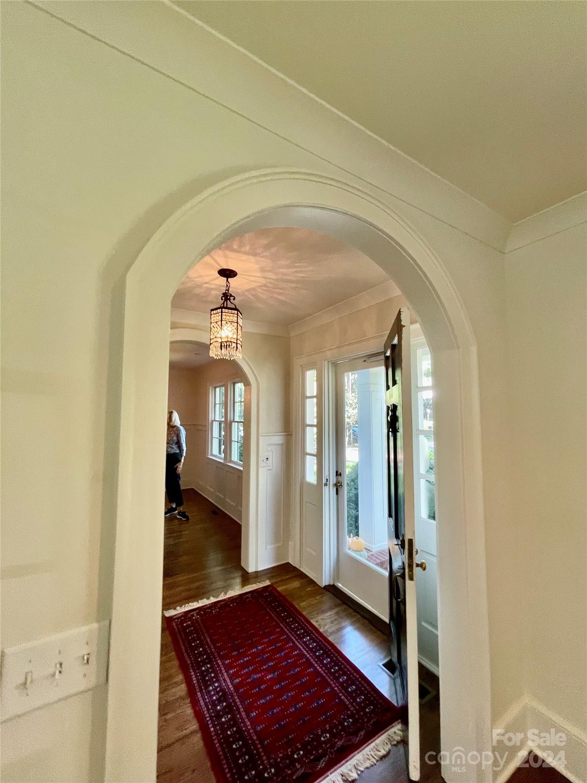 526 Lorimer Road Davidson, NC 28036 - Photo 8 of 41 a view of a hallway with wooden floor and staircase